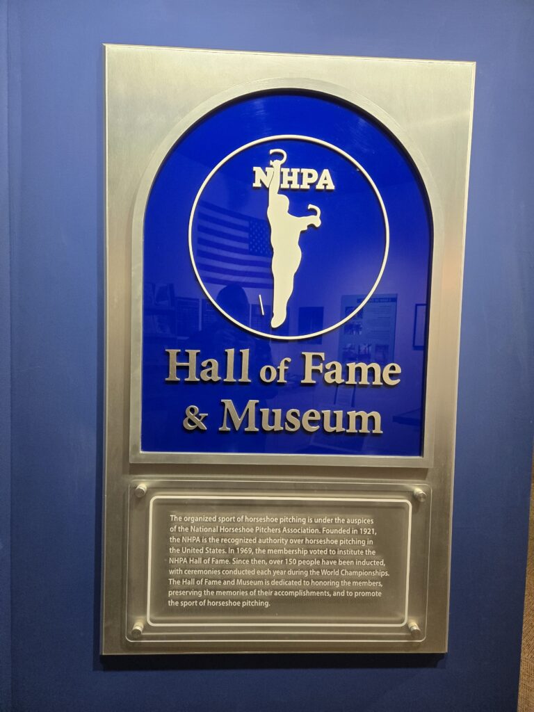 A plaque commemorating the National Horseshoe Pitchers Hall of Fame and Museum.