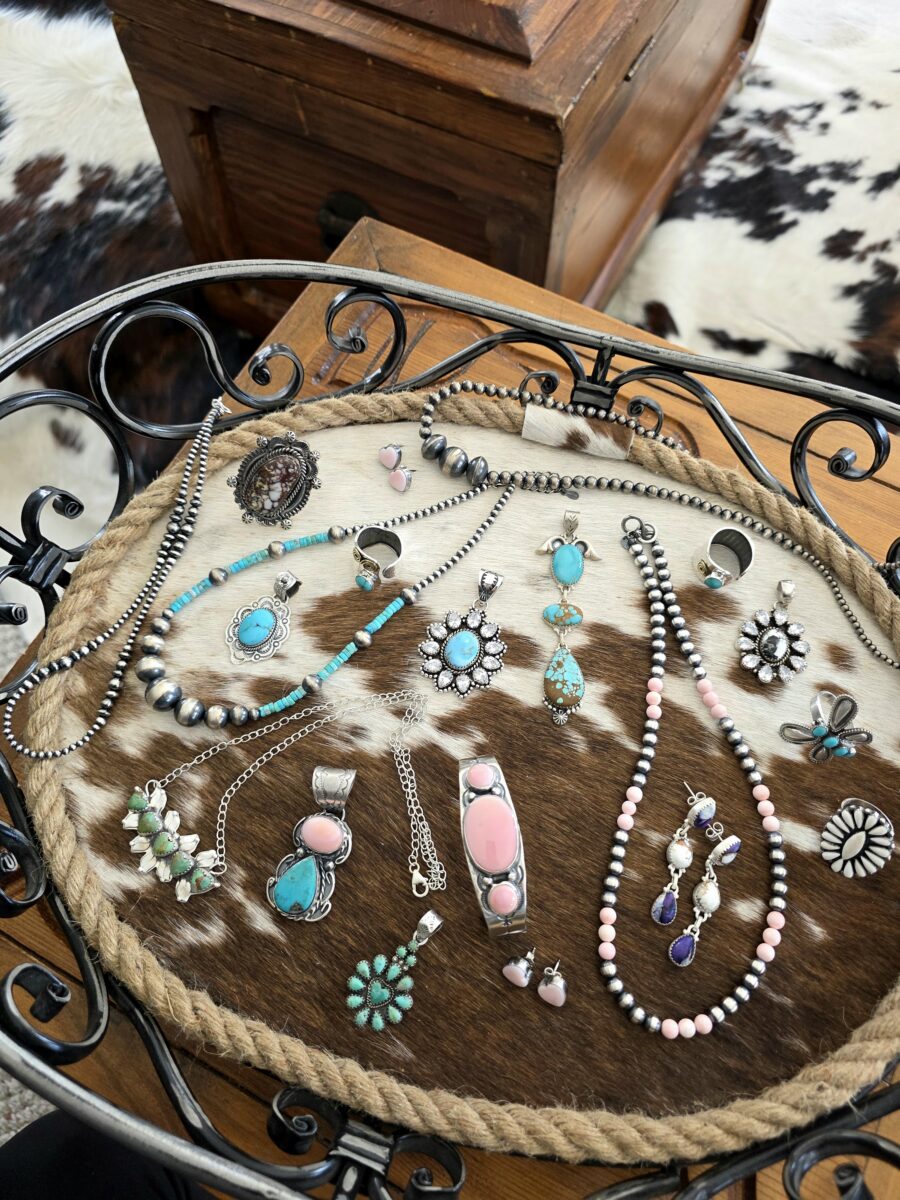 Jewelry displayed on a piece of furniture.