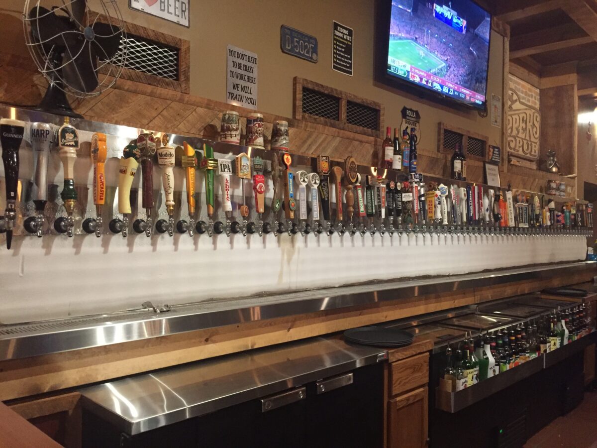 A bar with many beer taps.