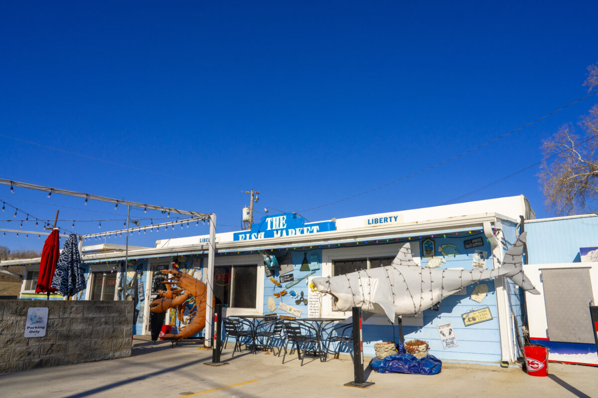 Outdoor patio and exterior view of The Fish Market seafood restaurant in Liberty Missouri