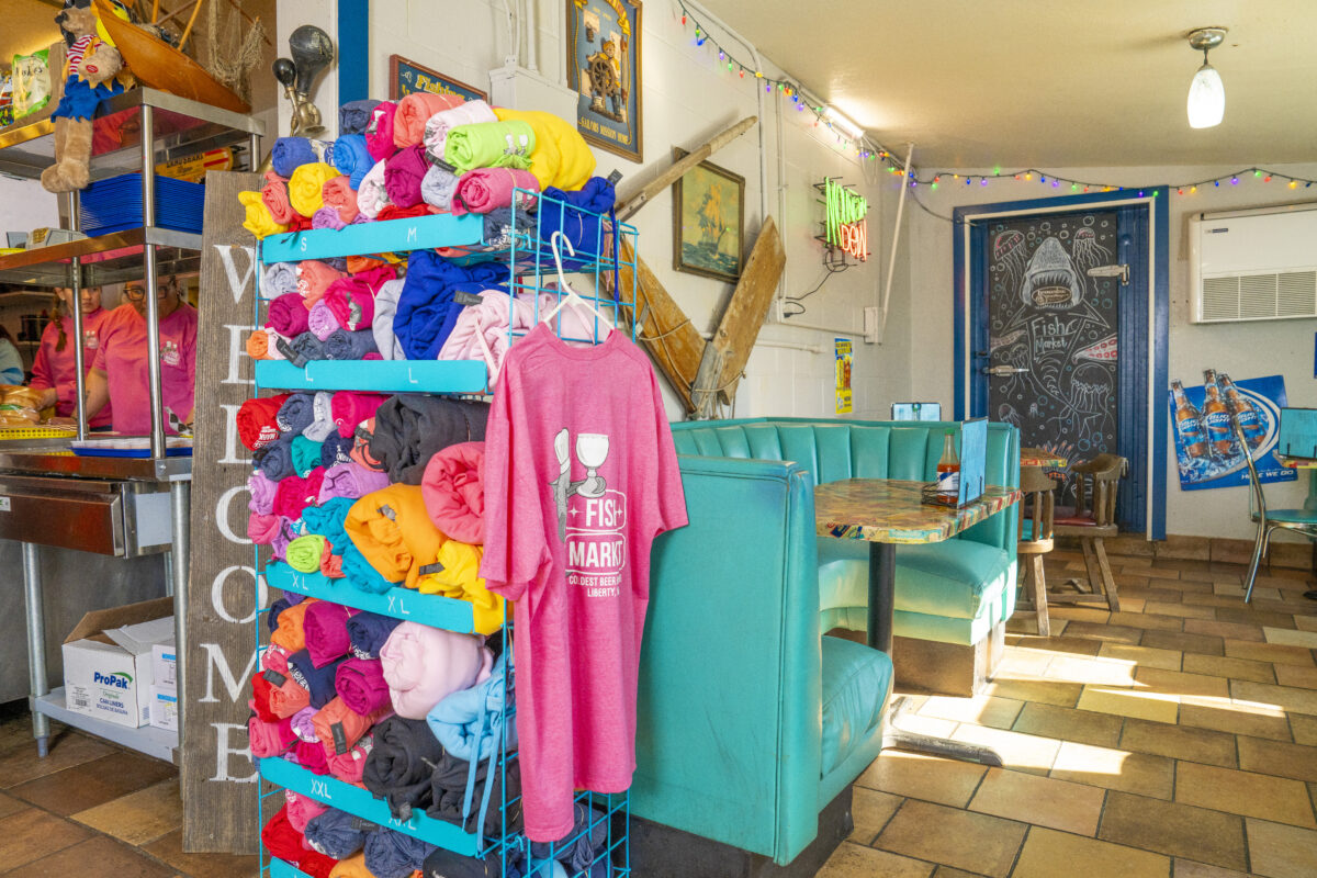 The Fish Market gift shop display with branded shirts and merchandise