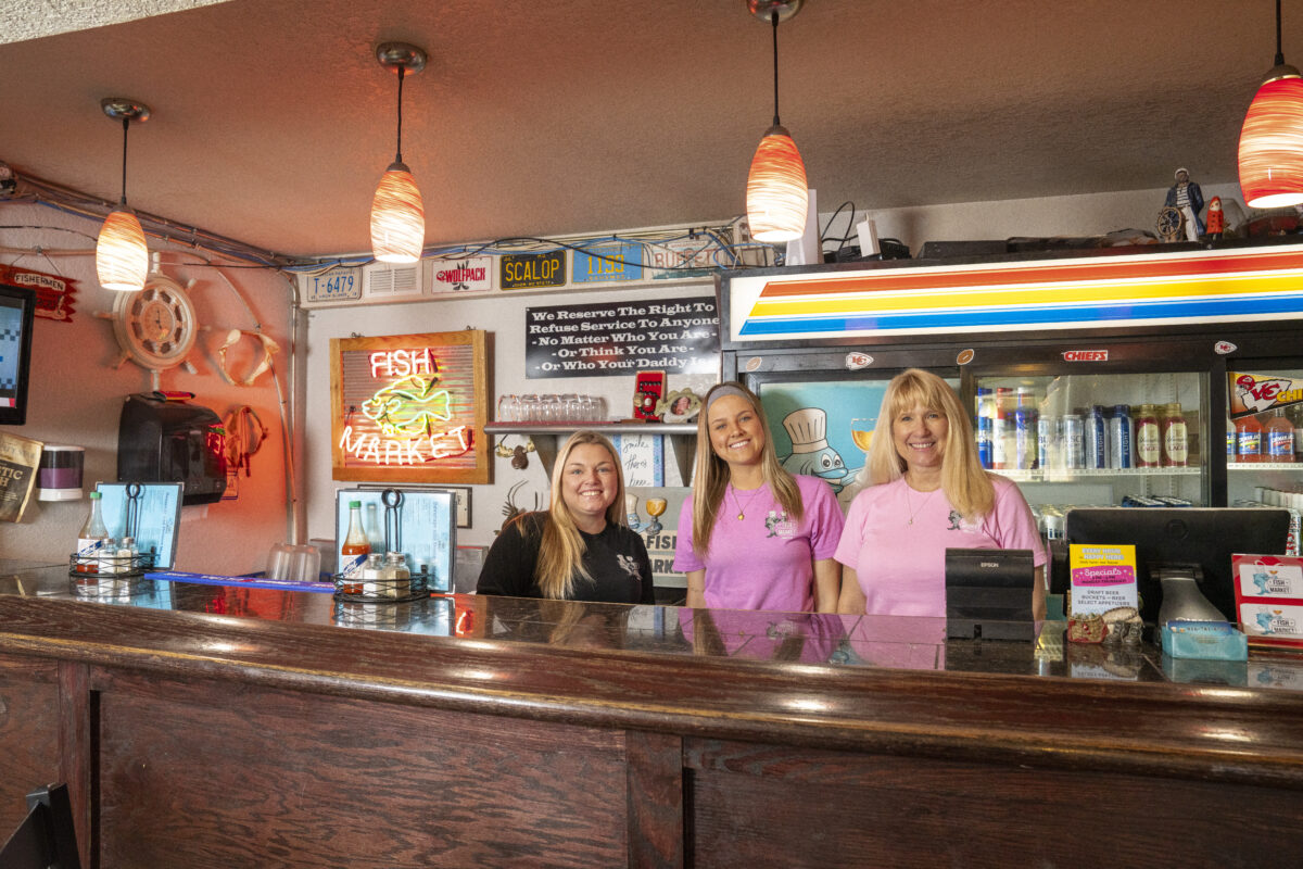 Friendly staff behind the bar at The Fish Market seafood restaurant in Liberty Missouri