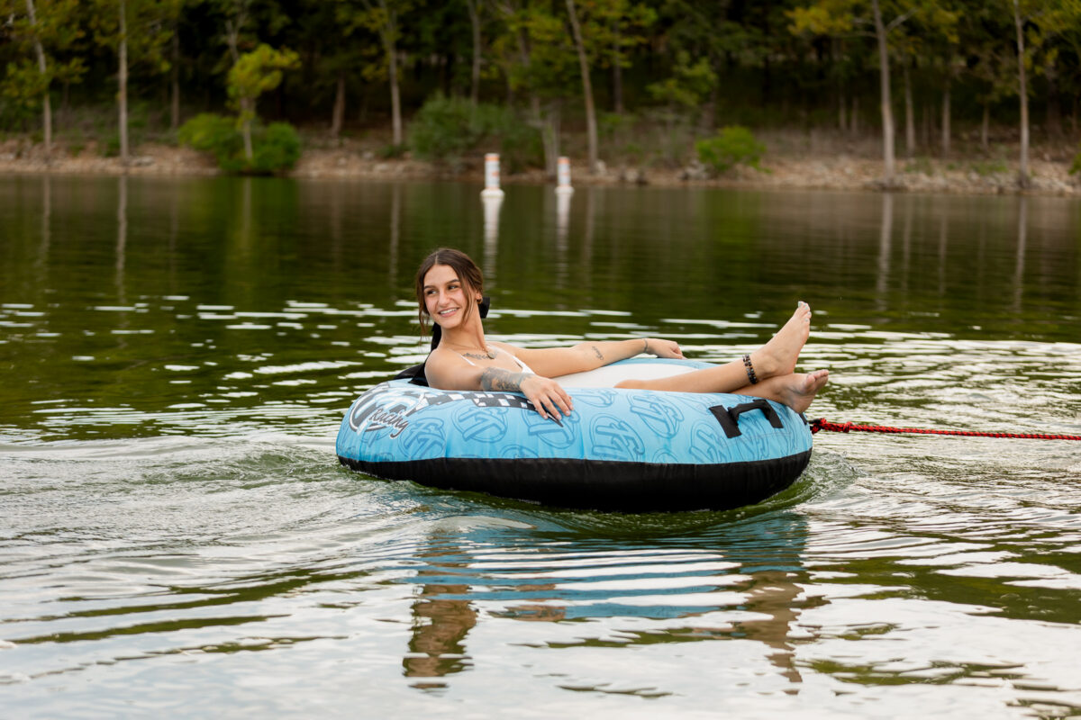Someone on a towable tube in the water.