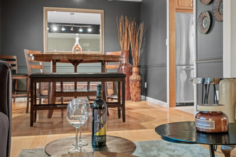 A warmly lit dining and game space in a home.