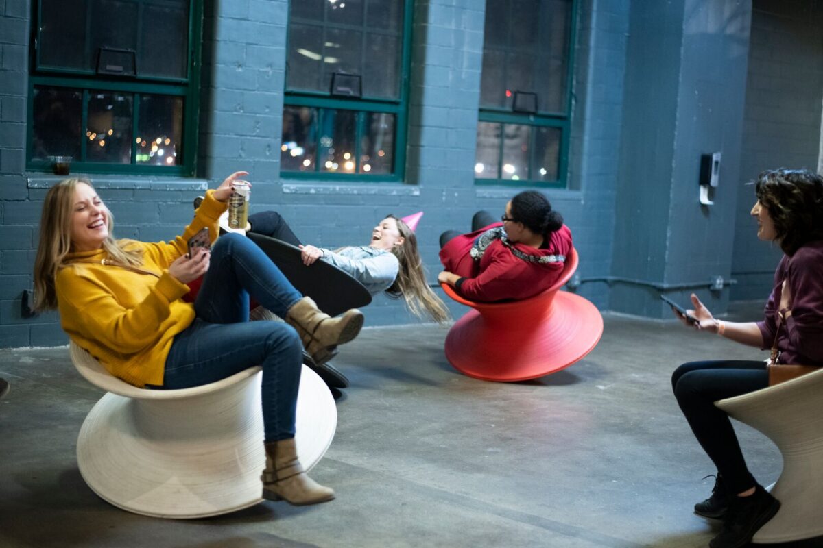 Four visitors in architectural Spun chairs at the City Museum, a quintessential landmark located in the historic Washington Avenue Loft District of Downtown St. Louis, Missouri.