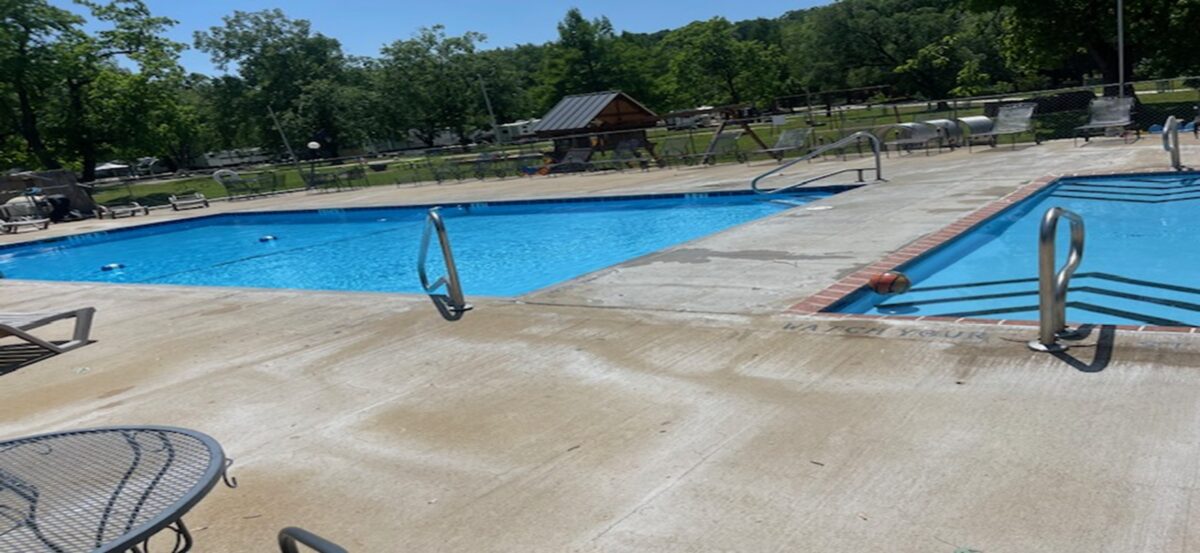 Outdoor concrete pools with furniture.