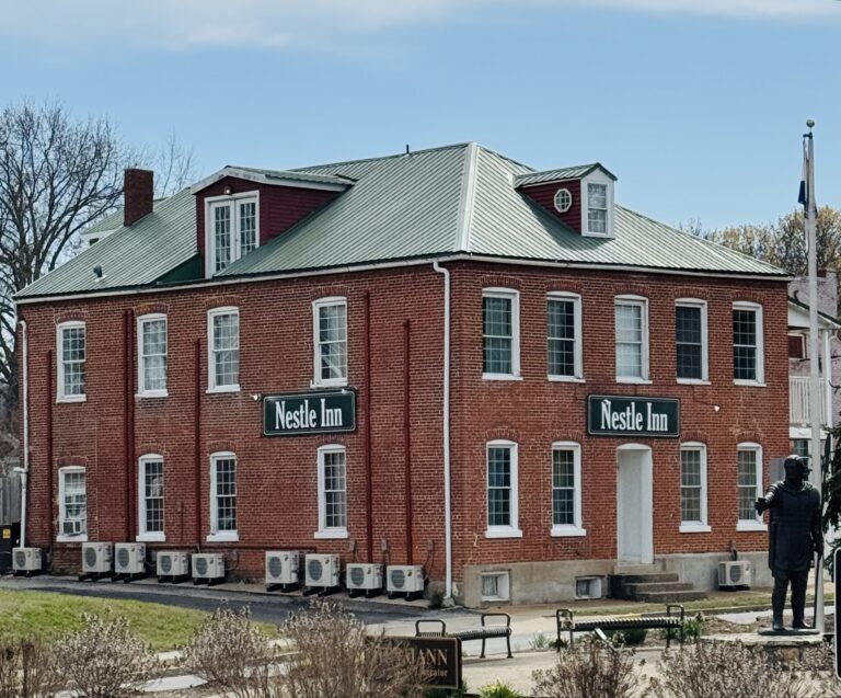 The outside of a two-story brick building.