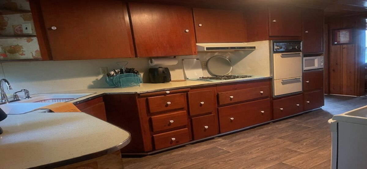 Interior of a kitchen with brown furnishings.