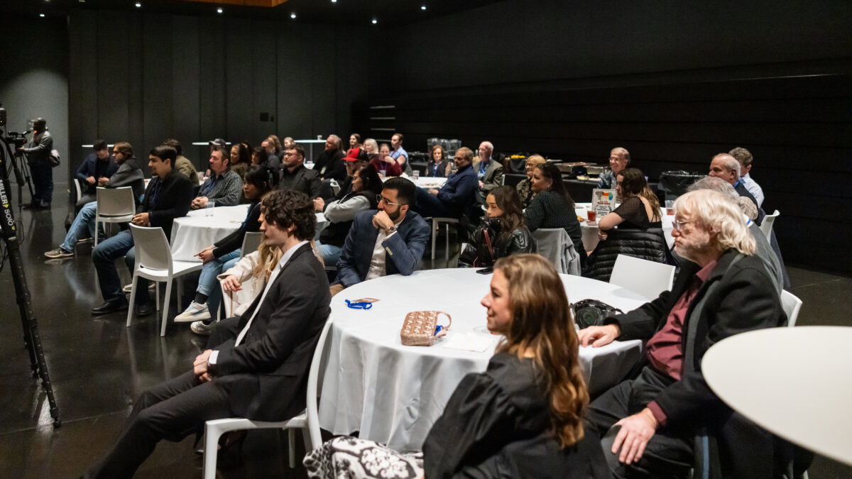 Dozens fill seats at an awards show.