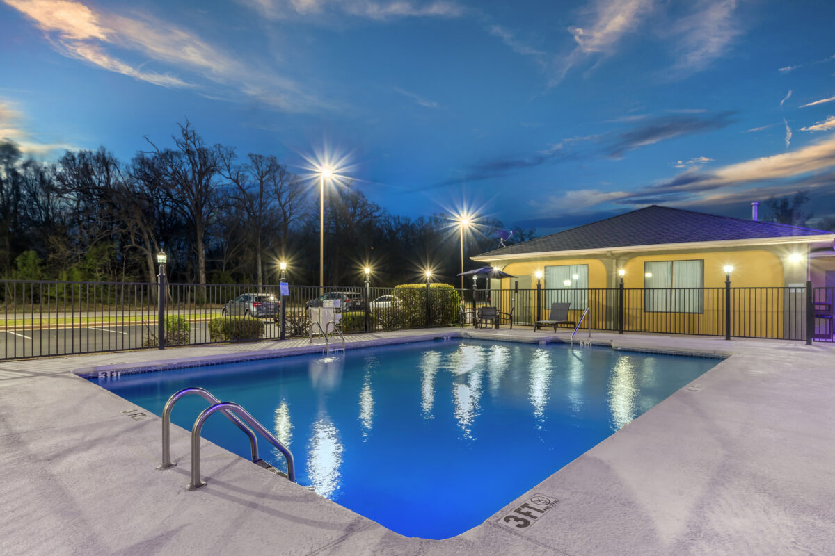An outdoor swimming pool in the evening.