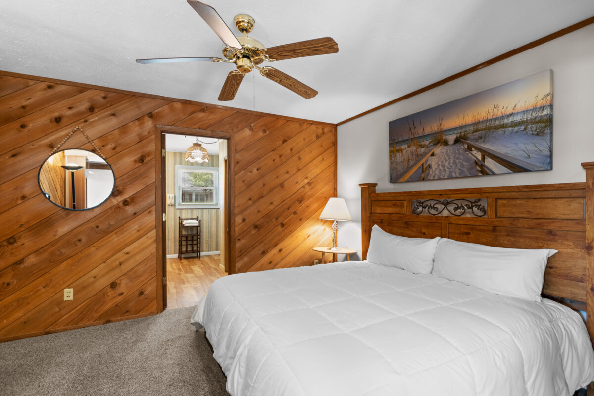 A bedroom with wood tones.