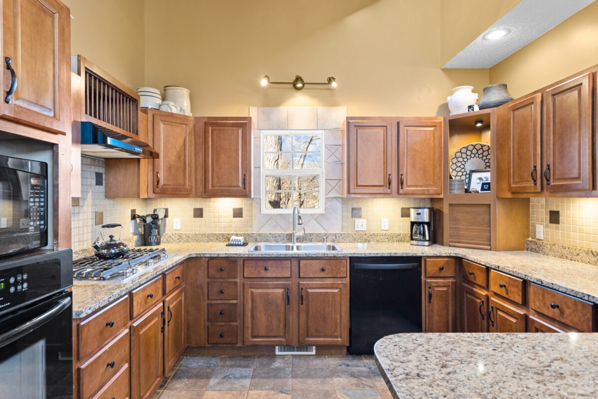 A kitchen area with stone and wood accents.