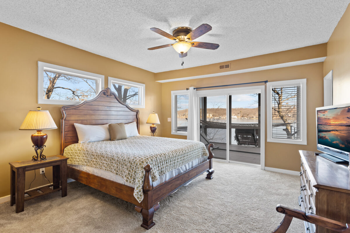 A bedroom with warm lighting.