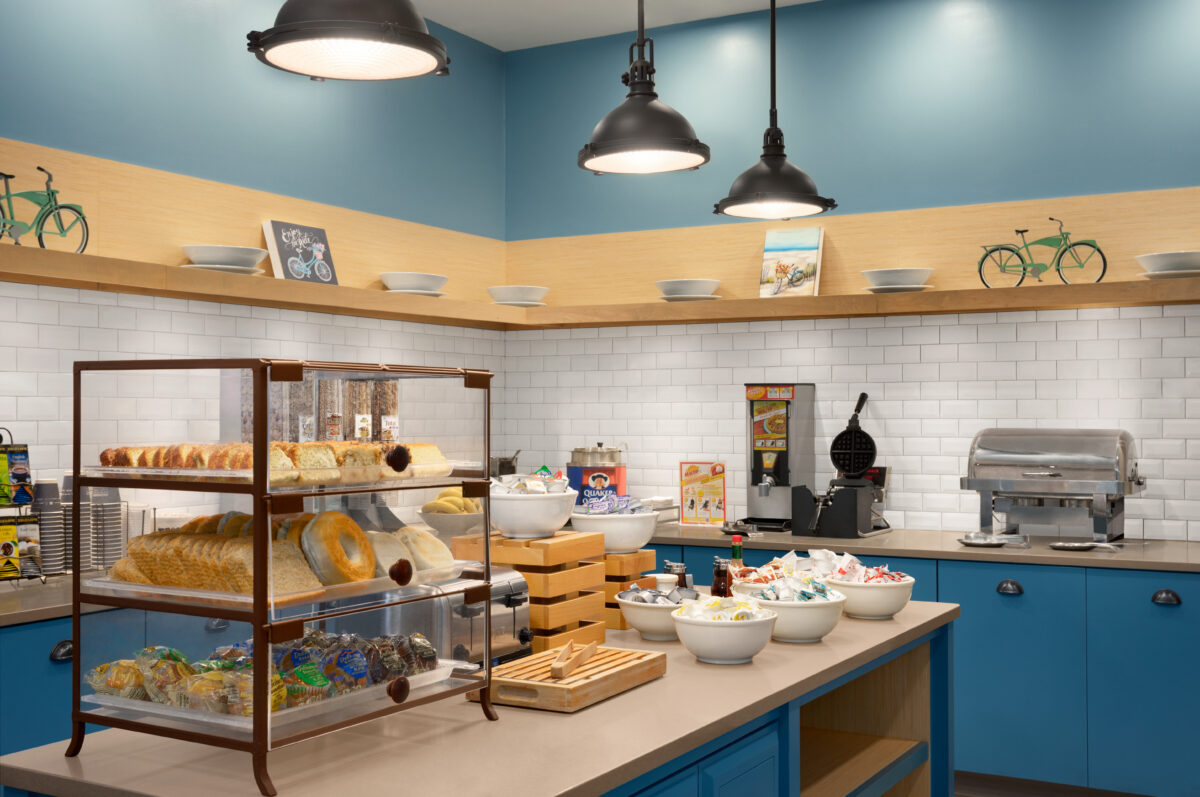 The interior of a kitchen, with racks and counter space.