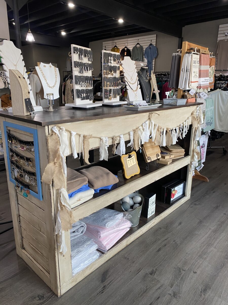 An inside display shelf with clothing and accessories.