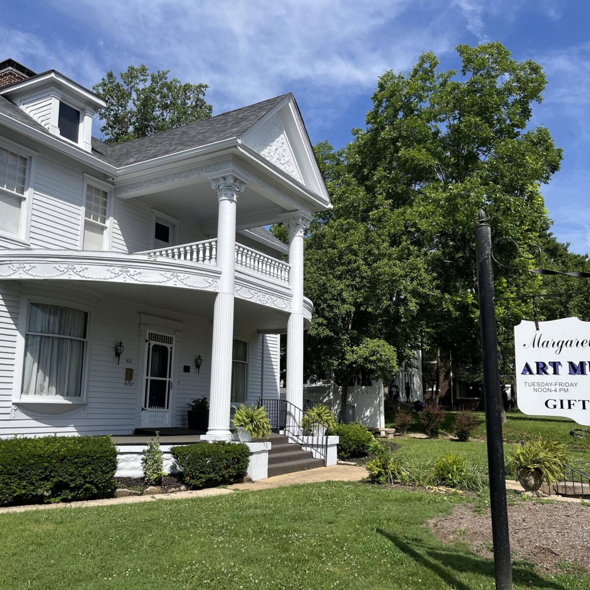 The exterior of a white two-story art museum