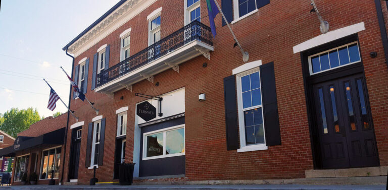 The exterior of an eclectic brick building.