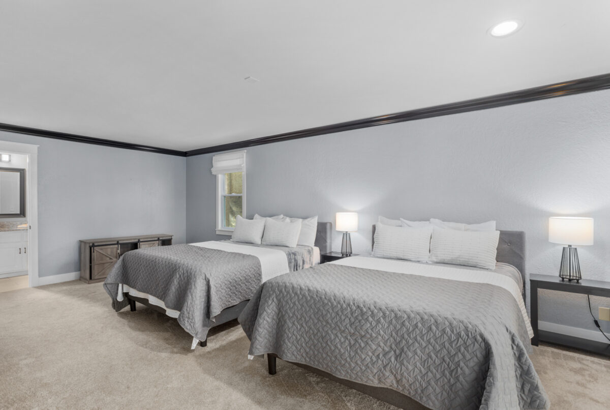 A bedroom with wood and white accents.