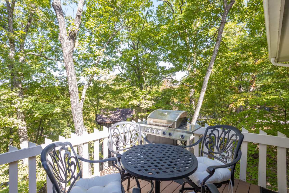 A patio with wood and white accents.
