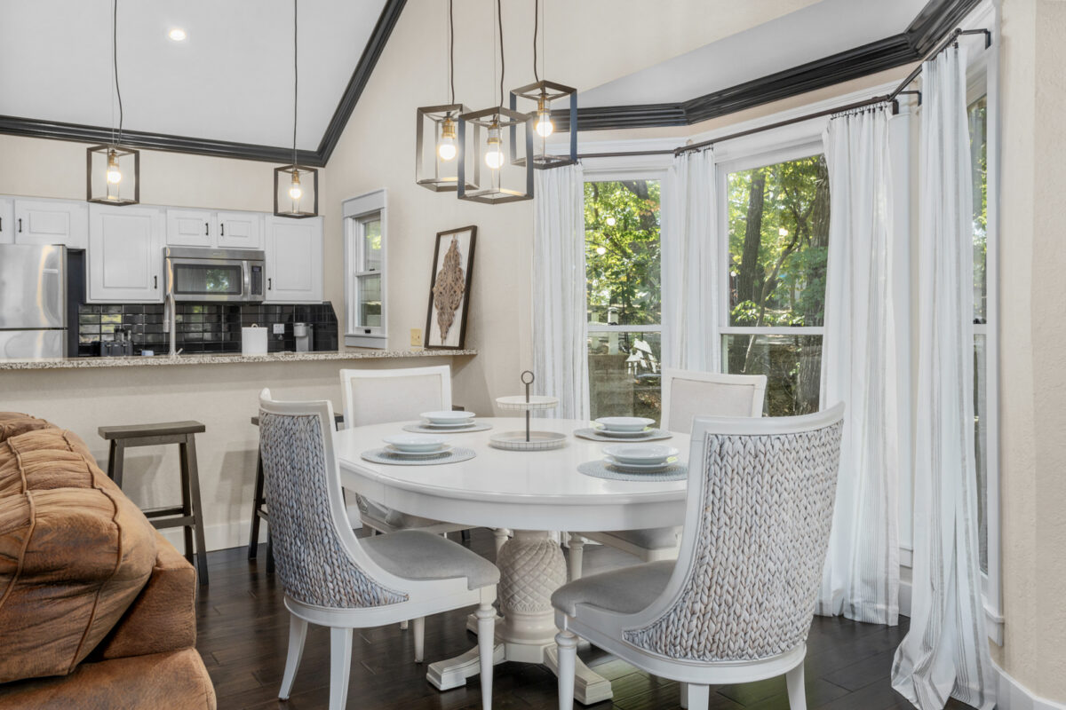 A dining room with wood and white accents.
