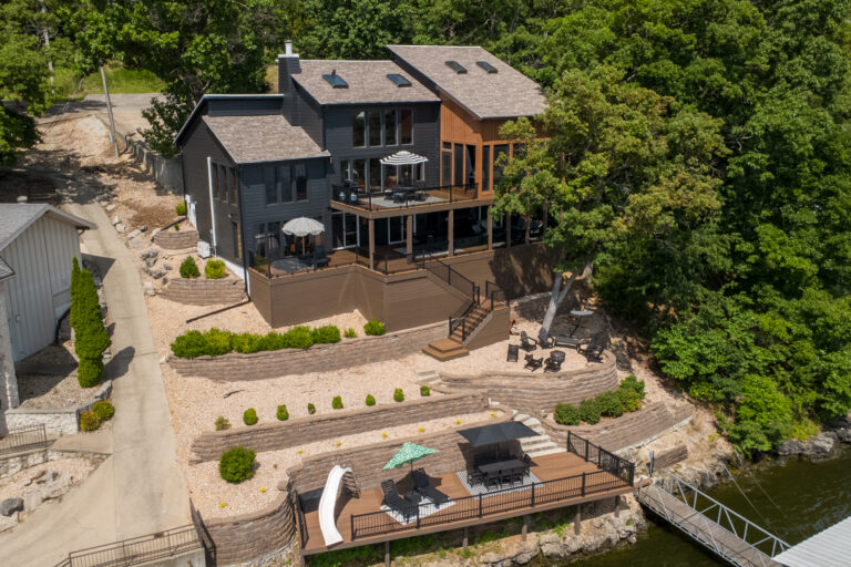 An aerial view of a lake house.