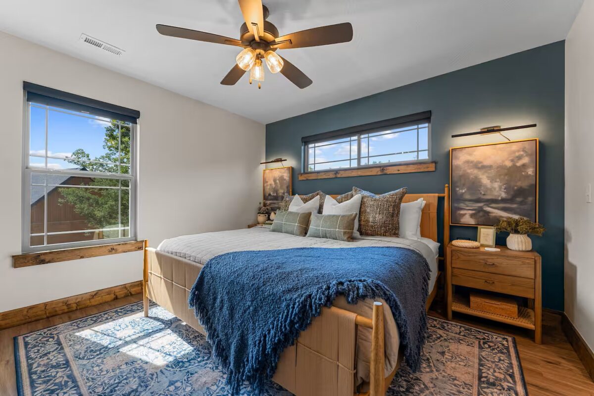 Plaid Fox upstairs bedroom with a large bed and eclectic furnishings.