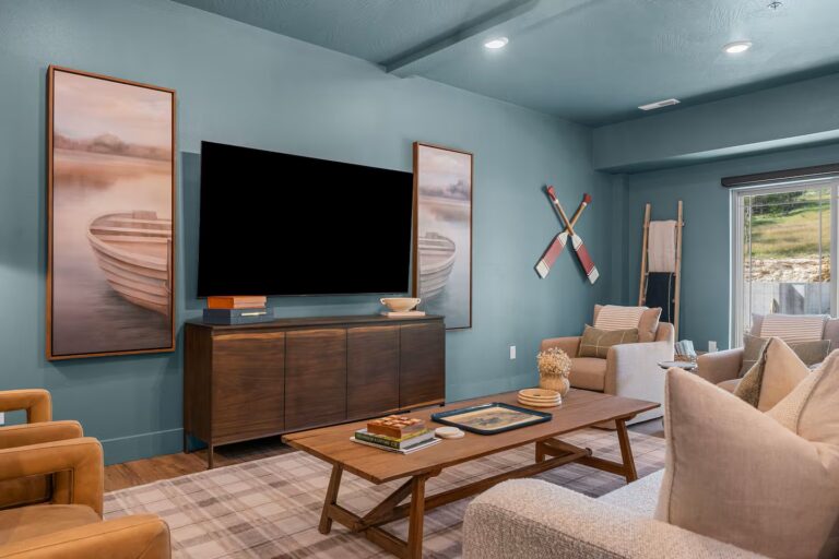 Plaid Fox basement featuring a TV, seating and table, and decorations.