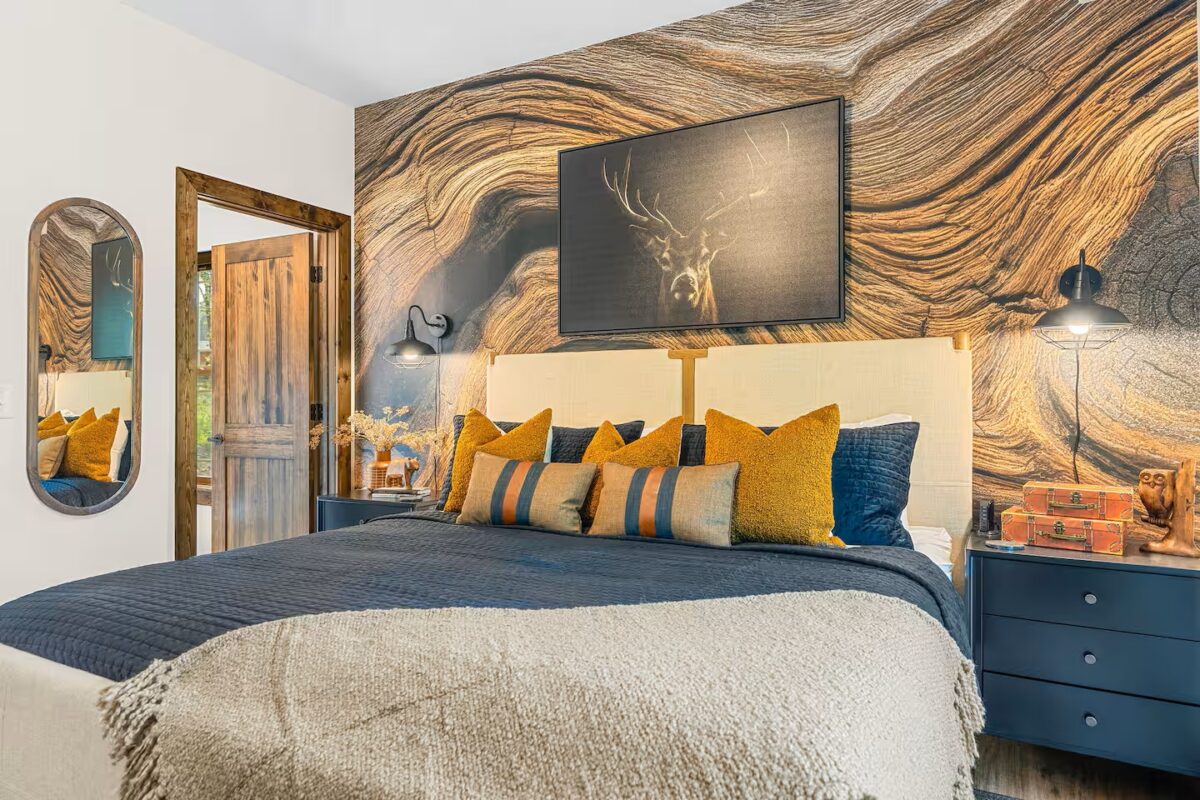 Plaid Fox primary bedroom with a large bed and eclectic furnishings.