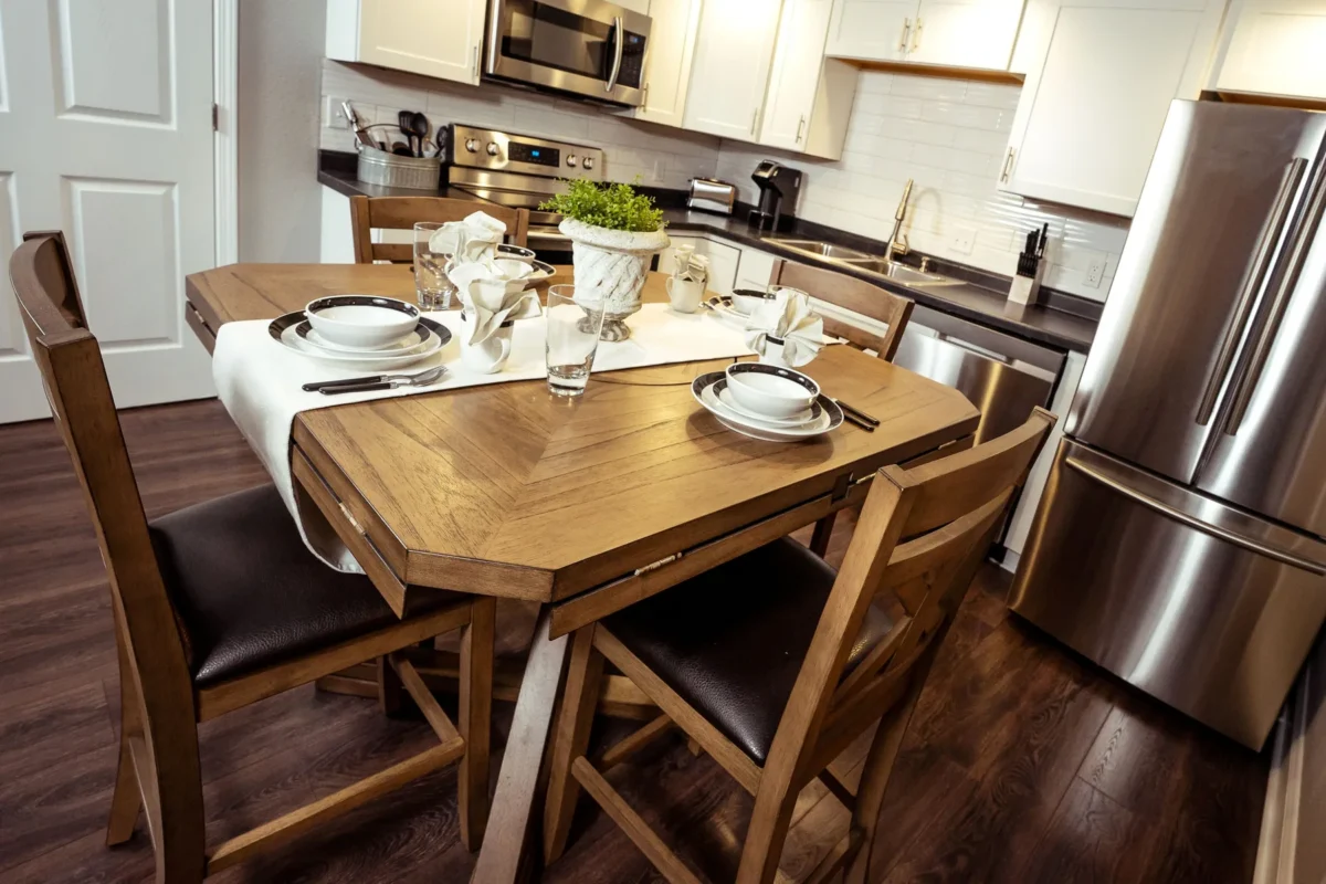 Full kitchen and dining table in a Branson King Resort suite