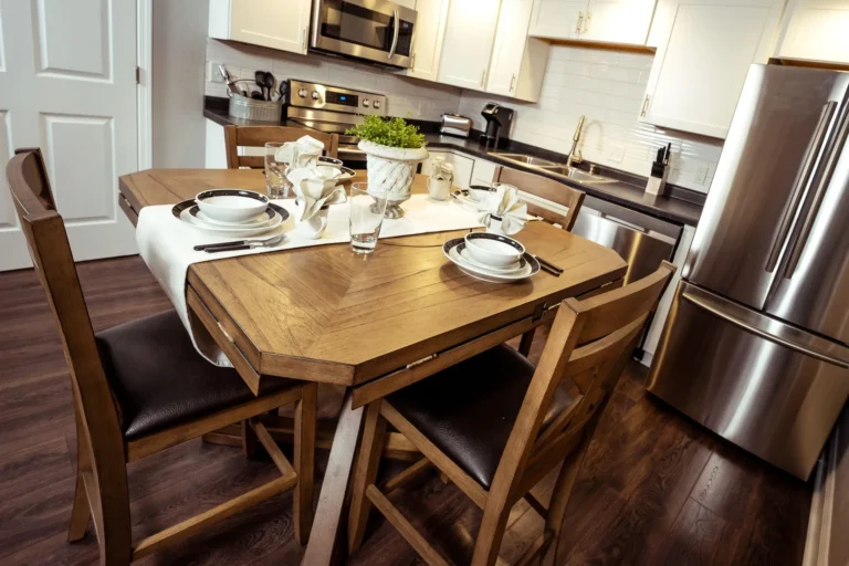 Full kitchen and dining table in a Branson King Resort suite