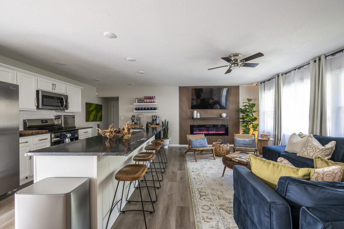 Modern living room and gathering space at The Blue Villa vacation rental in Lee's Summit