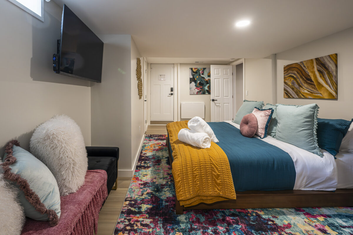 Comfortable king bedroom at The Blue Villa vacation rental in Lee's Summit, Missouri