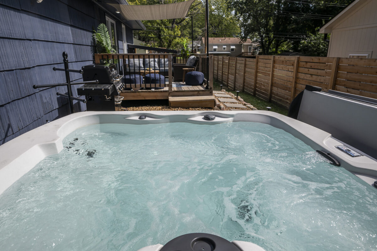 Private outdoor hot tub at The Blue Villa vacation rental in Lee's Summit, Missouri.