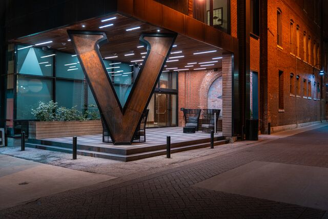 A large "V" sign marks the entrance to the Vandivort Hotel building.