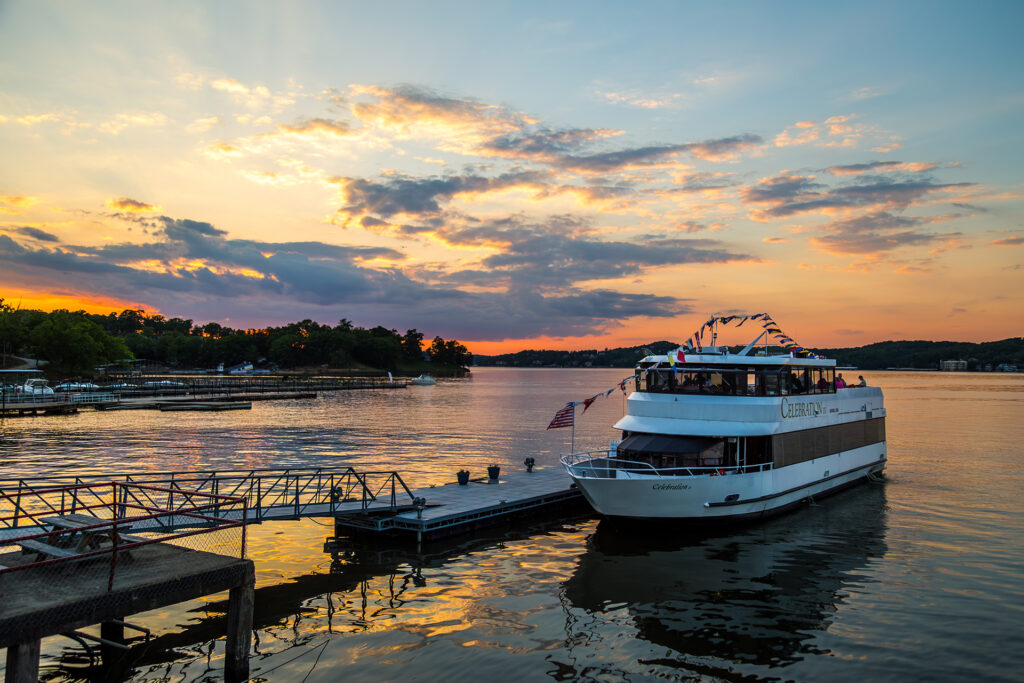 Cruise ship sits at the dock during sunset.